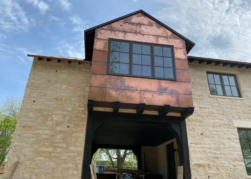 Copper metal panel facade on a stone building for Metal Roof Coating in Lake Forest